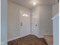 Welcoming entryway with sleek floors, leading to carpeted stairs and storage at 366 Springfield Cir, Greenwood, IN 46143