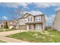 Charming two-story home with a well-manicured lawn and a two car garage at 366 Springfield Cir, Greenwood, IN 46143