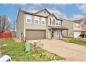 Charming two-story home with a well-manicured lawn and a two car garage at 366 Springfield Cir, Greenwood, IN 46143