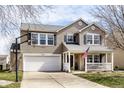 Beautiful two-story home featuring a two-car garage and a basketball hoop in the driveway at 5687 N Plymouth Ct, McCordsville, IN 46055