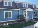 Inviting home with a covered front porch and classic architectural details at 590 W Cedar St, Zionsville, IN 46077