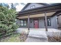 Charming home featuring a welcoming front porch and nicely landscaped yard at 615 E Morris St, Indianapolis, IN 46203