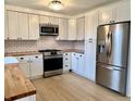 Well-equipped kitchen with stainless steel appliances, ample storage, and stylish finishes at 7874 E County Road 200 N, Avon, IN 46123