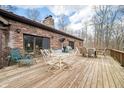 Spacious wooden deck with outdoor seating, perfect for entertaining with a view of the yard at 8968 Old Haggard Rd, Morgantown, IN 46160