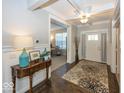 Elegant foyer with hardwood floors and an adjacent office space at 10027 Landis Blvd, Fishers, IN 46040