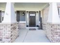 Charming covered front porch with stylish decor at 10027 Landis Blvd, Fishers, IN 46040