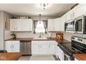 Bright kitchen with stainless steel appliances, white cabinets, tile backsplash, and wood countertops at 12929 Shandon Ln, Fishers, IN 46038