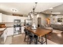 Eat-in kitchen featuring stainless steel appliances, modern lighting, and wood countertops at 12929 Shandon Ln, Fishers, IN 46038