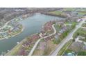 Stunning aerial view of lakeside community with waterfront homes and lush green spaces at 1847 Crystal Bay East Dr, Plainfield, IN 46168