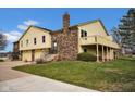 Attractive multi-level home with an attached garage, brick chimney, and a raised outdoor deck at 1847 Crystal Bay East Dr, Plainfield, IN 46168
