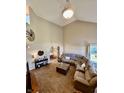 Spacious living room with high ceilings, neutral paint, and abundant natural light coming from the large windows at 1905 Collingwood Dr, Avon, IN 46123