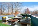 Inviting rooftop deck with stylish seating, perfect for relaxing and entertaining with neighborhood views at 242 N Tacoma Ave, Indianapolis, IN 46201