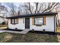Charming home with white siding, wood shutters, manicured lawn, and fresh landscaping at 2835 S Lyons Ave, Indianapolis, IN 46241