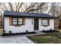 Charming home with white siding, wood shutters, manicured lawn, and fresh landscaping at 2835 S Lyons Ave, Indianapolis, IN 46241