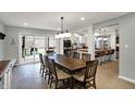 Elegant dining room featuring tile floors and sliding glass doors at 381 Redbud Pl, Greenwood, IN 46142