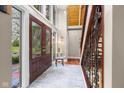 Bright foyer with soaring ceilings, an elegant staircase, and hardwood floors at 3849 Waycross Dr, Columbus, IN 47203