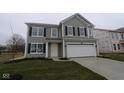 Charming two-story home with gray siding, black shutters, and an attached two-car garage at 3913 Highcrest Rd, Indianapolis, IN 46239