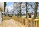 Inviting new deck with wooden railing offers a beautiful view of the surrounding neighborhood at 435 N Chestnut St, Monrovia, IN 46157
