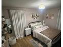 Relaxing bedroom with neutral tones, decorative wall hangings, and soft textures at 4904 Betholm Dr, Indianapolis, IN 46239