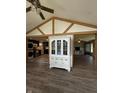 Open living area showcasing hardwood floors and modern design, connecting seamlessly to the kitchen at 4904 Betholm Dr, Indianapolis, IN 46239