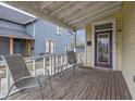 Cozy front porch featuring a seating area with chairs and a small table, perfect for relaxing outdoors at 602 Prospect St, Indianapolis, IN 46203