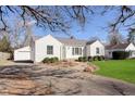 Lovely single-story home with a private driveway and mature trees offering shade and curb appeal at 6721 Evanston Ave, Indianapolis, IN 46220