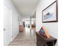 Welcoming foyer with hardwood floors and decor leading into the home's open living spaces at 981 Mound St, Bargersville, IN 46106