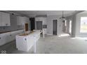 Spacious kitchen featuring white cabinets and a large island ready for customization at 10609 Banyan Wood Ct, Indianapolis, IN 46239