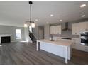 Spacious eat-in kitchen with an island, stainless appliances and hardwood floors at 10609 Banyan Wood Ct, Indianapolis, IN 46239