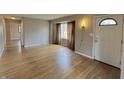 Spacious living room featuring hardwood floors, natural light, and neutral wall color at 125 Ursal Ln, Greenwood, IN 46143
