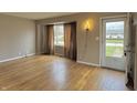 Bright living room featuring hardwood floors, neutral walls, and an abundance of natural light at 125 Ursal Ln, Greenwood, IN 46143