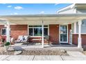 Inviting covered porch with seating area, ideal for enjoying the outdoors at 139 W Jefferson St, Jamestown, IN 46147
