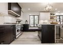 Modern kitchen featuring an island, stainless steel appliances, and sleek, two-tone cabinetry at 1448 Sedona Dr, Carmel, IN 46032