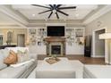 Cozy living room features a fireplace, custom built-ins, and comfortable seating at 15254 Kampen Cir, Carmel, IN 46033