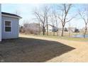 Spacious backyard featuring an expansive lawn and mature trees at 15925 Cobbs Crk Ln, Noblesville, IN 46060