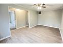 An empty room featuring light gray walls and modern wood-look flooring at 1640 W 7Th St, Anderson, IN 46016