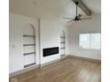 Bright living room with high ceilings, wood floors, fireplace, and stylish decor at 1716 E Kelly St, Indianapolis, IN 46203