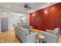 Stylish living room features hardwood floors, trendy decor, and plenty of natural light at 2155 S Delaware St, Indianapolis, IN 46225
