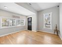 Inviting living room with hardwood floors, modern gray walls, and a bright window view at 2155 S Delaware St, Indianapolis, IN 46225