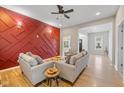 Stylish living room features hardwood floors, trendy decor, and plenty of natural light at 2155 S Delaware St, Indianapolis, IN 46225