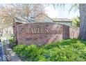 Welcoming brick sign at Maples of Carmel neighborhood entrance at 3013 Crimson W Ct # 42, Carmel, IN 46033