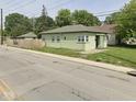Street view of single-story home, showcasing its simple design and surrounding neighborhood at 4330 E 16Th St, Indianapolis, IN 46201