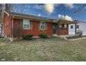Charming single-story brick house with a cozy covered porch and established landscaping at 4812 Eastgate Dr, Columbus, IN 47203