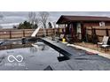 View of the in-ground pool with slide at 7154 S 325 W, Jamestown, IN 46147