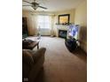 Comfortable living room with natural light and a decorative fireplace at 7399 Glendale Dr, Avon, IN 46123