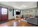 Comfortable living room with hardwood floors, a large window, and a cozy atmosphere for relaxation at 7916 W 275 N, Boggstown, IN 46110