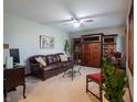 Comfortable living room with neutral carpeting, classic furnishings, and ample natural light at 7984 S Deer Lake Dr, Nineveh, IN 46164