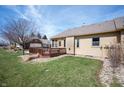 Private backyard featuring a wooden deck and well-maintained lawn and landscape at 946 Peppermill Run, Greenwood, IN 46143