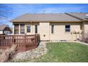 Private backyard featuring a wooden deck and well-maintained lawn at 946 Peppermill Run, Greenwood, IN 46143