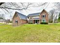 Traditional two-story home with brick and siding, offering a well-maintained lawn and landscaped front yard at 12917 Brighton Ln, Carmel, IN 46032
